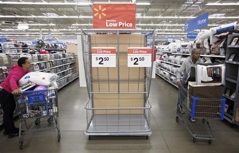 Shoppers make their way past an endcap that once held discounted pillows at a Walmart Store in Chicago, November 23, 2012. REUTERS/John Gres Shoppers make their way past an endcap that once held discounted pillows at a Walmart Store in Chicago, November 23, 2012. REUTERS/John Gres