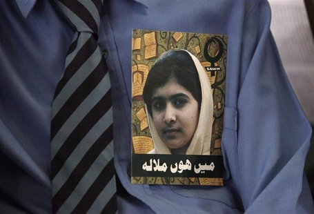 A Pakistani student, with a portrait of Malala Yousufzai on his shirt, attends a meeting organized by South Asian Women in Media to mark Mal A Pakistani student, with a portrait of Malala Yousufzai on his shirt, attends a meeting organized by South Asian Women in Media to mark Mal