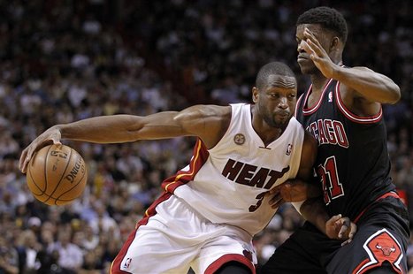 Miami Heat's Dwyane Wade (L) drives against Chicago Bulls' Jimmy Butler in the first half of their NBA basketball game in Miami, Florida Jan Miami Heat's Dwyane Wade (L) drives against Chicago Bulls' Jimmy Butler in the first half of their NBA basketball game in Miami, Florida Jan
