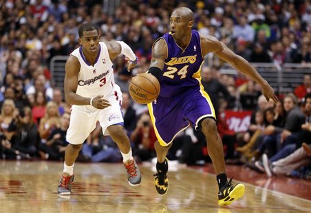 Los Angeles Lakers' Kobe Bryant (R) drives past Los Angeles Clippers' Chris Paul during the second half of their NBA basketball game in Los Los Angeles Lakers' Kobe Bryant (R) drives past Los Angeles Clippers' Chris Paul during the second half of their NBA basketball game in Los