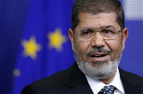 Egypt's President Mohamed Mursi answers reporters' questions after meeting European Commission President Jose Manuel Barroso (unseen) at the Egypt's President Mohamed Mursi answers reporters' questions after meeting European Commission President Jose Manuel Barroso (unseen) at the