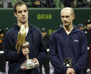 France's Richard Gasquet holds his trophy after he won the final against Nikolay Davydenko of Russia (R) at the Qatar Open in Doha January 5 France's Richard Gasquet holds his trophy after he won the final against Nikolay Davydenko of Russia (R) at the Qatar Open in Doha January 5