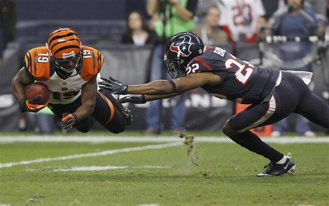 Cincinnati Bengals wide receiver Brandon Tate makes a catch in front of Houston Texans cornerback Alan Ball during the third quarter of thei Cincinnati Bengals wide receiver Brandon Tate makes a catch in front of Houston Texans cornerback Alan Ball during the third quarter of thei