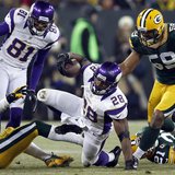 Minnesota Vikings running back Adrian Peterson (28) is brought down by Green Bay Packers inside linebacker Brad Jones (59) during their NFL Minnesota Vikings running back Adrian Peterson (28) is brought down by Green Bay Packers inside linebacker Brad Jones (59) during their NFL
