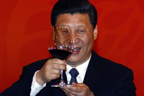 Chinese Vice-President Xi Jinping holds a glass of red wine as he toasts at a dinner, also attended by former U.S. secretary of state Henry Chinese Vice-President Xi Jinping holds a glass of red wine as he toasts at a dinner, also attended by former U.S. secretary of state Henry