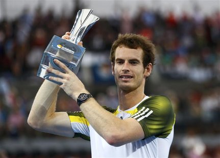 Andy Murray of Britain poses with the trophy after defeating Grigor Dimitrov of Bulgaria in their men's final match at the Brisbane Internat Andy Murray of Britain poses with the trophy after defeating Grigor Dimitrov of Bulgaria in their men's final match at the Brisbane Internat