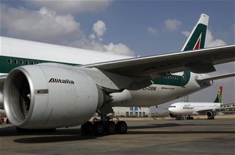 An Alitalia airplane is seen at the airport in Cairo January 20, 2011. Italy signed an agreement on Thursday with Egypt Air to carry out mai An Alitalia airplane is seen at the airport in Cairo January 20, 2011. Italy signed an agreement on Thursday with Egypt Air to carry out mai