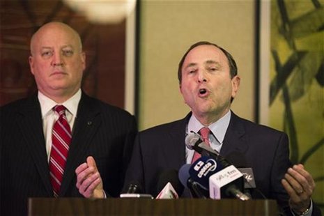 National Hockey League (NHL) Commissioner Gary Bettman gestures in front of NHL deputy commissioner Bill Daly (L) as he describes negotiatio National Hockey League (NHL) Commissioner Gary Bettman gestures in front of NHL deputy commissioner Bill Daly (L) as he describes negotiatio