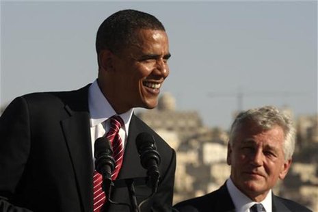 President Barack Obama (L) smiles next to Chuck Hagel (R-NE) during a news conference at the Amman Citadel, an ancient Roman landmark, in Am President Barack Obama (L) smiles next to Chuck Hagel (R-NE) during a news conference at the Amman Citadel, an ancient Roman landmark, in Am