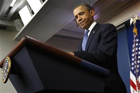 U.S. President Barack Obama opens his notes before remarks to reporters after meeting with congressional leaders at the White House in Washi U.S. President Barack Obama opens his notes before remarks to reporters after meeting with congressional leaders at the White House in Washi