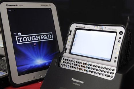 Panasonic Toughpad (L) and handheld Toughbook model are displayed at the company's IT products headquarters in Moriguchi, western Japan Dece Panasonic Toughpad (L) and handheld Toughbook model are displayed at the company's IT products headquarters in Moriguchi, western Japan Dece