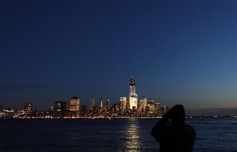A man photographs the skyline of Lower Manhattan in New York from a park along the Hudson River in Hoboken, New Jersey, December 28, 2012. R A man photographs the skyline of Lower Manhattan in New York from a park along the Hudson River in Hoboken, New Jersey, December 28, 2012. R