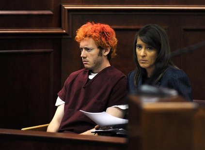 Colorado shooting suspect James Eagan Holmes (L) sits with public defender Tamara Brady during his first court appearance in Aurora, Colorad Colorado shooting suspect James Eagan Holmes (L) sits with public defender Tamara Brady during his first court appearance in Aurora, Colorad