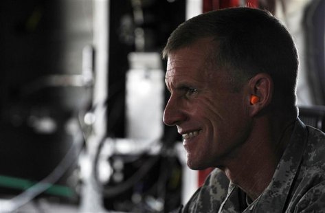 The U.S. and NATO commander in Afghanistan U.S. General Stanley McChrystal wears earplugs as he leaves by helicopter after a meeting between The U.S. and NATO commander in Afghanistan U.S. General Stanley McChrystal wears earplugs as he leaves by helicopter after a meeting between