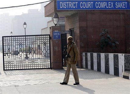 A policeman keeps guard outside a court in New Delhi January 7, 2013. Five men accused of the gang rape and murder of an Indian student appe A policeman keeps guard outside a court in New Delhi January 7, 2013. Five men accused of the gang rape and murder of an Indian student appe