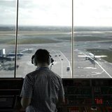 An air traffic controller monitors aircraft movement from the control tower at Manchester Airport, northern England, February 3, 2011. REUTE An air traffic controller monitors aircraft movement from the control tower at Manchester Airport, northern England, February 3, 2011. REUTE