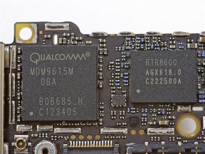 Handout image released by iFixit.com shows the Qualcomm MDM9615M chip on a board of a new iPhone 5 in Melbourne, Australia September 21, 201 Handout image released by iFixit.com shows the Qualcomm MDM9615M chip on a board of a new iPhone 5 in Melbourne, Australia September 21, 201