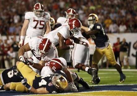 Alabama Crimson Tide running back T.J. Yeldon (4) scores a touchdown against the Notre Dame Fighting Irish in the second quarter of their NC Alabama Crimson Tide running back T.J. Yeldon (4) scores a touchdown against the Notre Dame Fighting Irish in the second quarter of their NC
