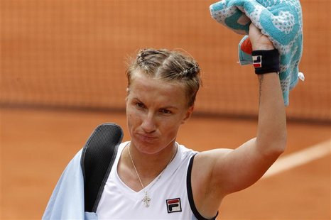 Svetlana Kuznetsova of Russia leaves the court after losing her match against Sara Errani of Italy during the French Open tennis tournament Svetlana Kuznetsova of Russia leaves the court after losing her match against Sara Errani of Italy during the French Open tennis tournament