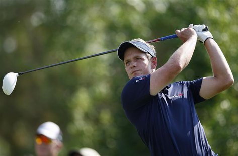 Luke Donald of England watches his shot from the third tee during the final round of the DP World Tour Championship at Jumeirah Golf Estates Luke Donald of England watches his shot from the third tee during the final round of the DP World Tour Championship at Jumeirah Golf Estates