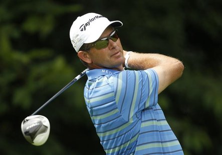 South Africa's Retief Goosen tees off a ball at the third hole during the first day of the International Golf Open in Pulheim near Cologne J South Africa's Retief Goosen tees off a ball at the third hole during the first day of the International Golf Open in Pulheim near Cologne J