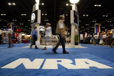 People walk inside the Orlando Convention Center at the 132nd Annual National Rifle Association Meeting in in Orlando, Florida April 27, 200 People walk inside the Orlando Convention Center at the 132nd Annual National Rifle Association Meeting in in Orlando, Florida April 27, 200