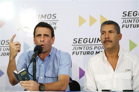 Venezuelan opposition governor of Miranda Henrique Capriles (L) speaks as governor of Lara Henri Falcon listens at a news conference in Cara Venezuelan opposition governor of Miranda Henrique Capriles (L) speaks as governor of Lara Henri Falcon listens at a news conference in Cara