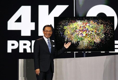Panasonic chief Kazuhiro Tsuga introduces the company's new 4K OLED 56" television during the Panasonic opening day keynote at the Consumer Panasonic chief Kazuhiro Tsuga introduces the company's new 4K OLED 56" television during the Panasonic opening day keynote at the Consumer