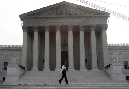 A police officer patrols the front of the U.S. Supreme Court prior to the swearing in of judge Sonia Sotomayor to the Court in Washington, A A police officer patrols the front of the U.S. Supreme Court prior to the swearing in of judge Sonia Sotomayor to the Court in Washington, A