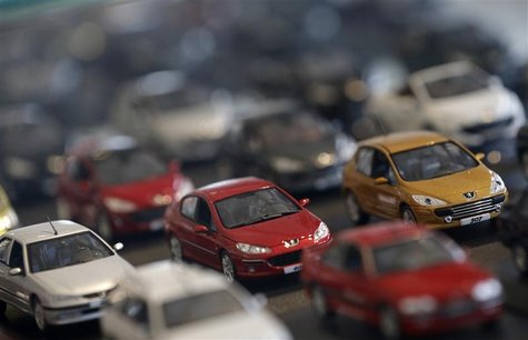 Peugeot miniature model cars are lined-up at French carmaker PSA Peugeot Citroen headquarters store in Paris, November 5, 2012. REUTERS/Chri Peugeot miniature model cars are lined-up at French carmaker PSA Peugeot Citroen headquarters store in Paris, November 5, 2012. REUTERS/Chri