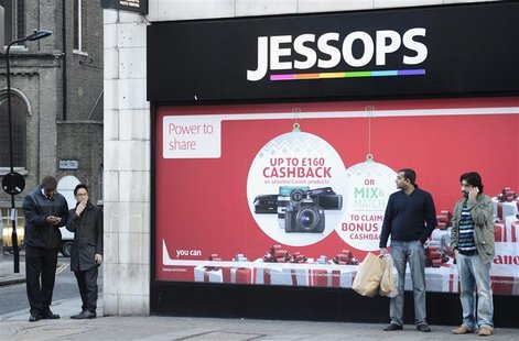 Men stand outside a Jessops shop in central London January 9, 2013. REUTERS/Paul Hackett Men stand outside a Jessops shop in central London January 9, 2013. REUTERS/Paul Hackett