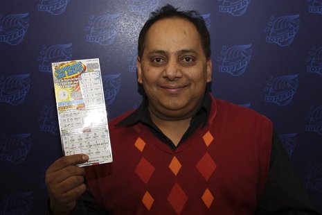Urooj Khan is pictured holding his winning lottery ticket in this undated handout photo from the Illinois Lottery. Khan died of cyanide pois Urooj Khan is pictured holding his winning lottery ticket in this undated handout photo from the Illinois Lottery. Khan died of cyanide pois