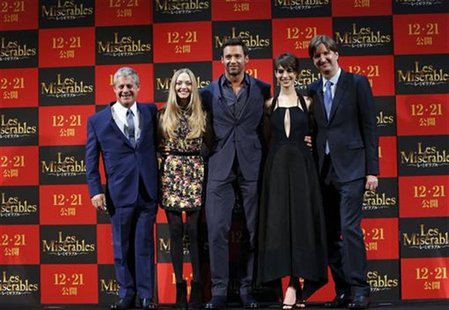 Producer Cameron Mackintosh, cast members Amanda Michelle Seyfried, Hugh Jackman and Anne Hathaway, and director Tom Hooper (L-R) pose at a Producer Cameron Mackintosh, cast members Amanda Michelle Seyfried, Hugh Jackman and Anne Hathaway, and director Tom Hooper (L-R) pose at a