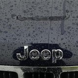 A wet Jeep logo and grill is shown at the Criswell Chrysler-Dodge-Jeep-Fiat-Ram truck dealership in Gaithersburg, Maryland October 2, 2012. A wet Jeep logo and grill is shown at the Criswell Chrysler-Dodge-Jeep-Fiat-Ram truck dealership in Gaithersburg, Maryland October 2, 2012.
