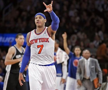 New York Knicks' forward Carmelo Anthony (7) celebrates a three-point shot against the San Antonio Spurs in the third quarter of their NBA b New York Knicks' forward Carmelo Anthony (7) celebrates a three-point shot against the San Antonio Spurs in the third quarter of their NBA b