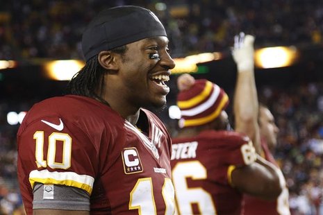 Washington Redskins quarterback Robert Griffin III (10) smiles on the sideline as time runs out in his team's victory over the Dallas Cowboy Washington Redskins quarterback Robert Griffin III (10) smiles on the sideline as time runs out in his team's victory over the Dallas Cowboy
