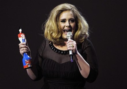 Adele speaks as she holds her award for best British female solo artist during the BRIT Music Awards at the O2 Arena in London February 21, Adele speaks as she holds her award for best British female solo artist during the BRIT Music Awards at the O2 Arena in London February 21,