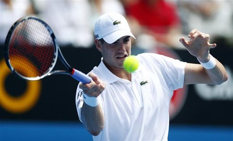 John Isner of U.S. hits a return to compatriot Ryan Harrison during their men's singles match at the Sydney International tennis tournament John Isner of U.S. hits a return to compatriot Ryan Harrison during their men's singles match at the Sydney International tennis tournament