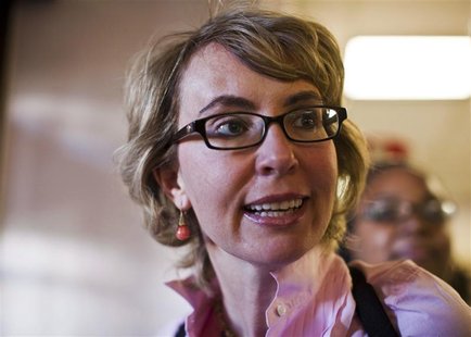 Former congresswoman Gabrielle Giffords and Congressman Ron Barber (not pictured) leave the Pima County Recorder's office after casting thei Former congresswoman Gabrielle Giffords and Congressman Ron Barber (not pictured) leave the Pima County Recorder's office after casting thei
