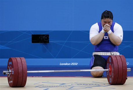 South Korea's Jang Mi-Ran reacts after failing to lift on her third attempt in the women's +75kg group A clean and jerk weightlifting compet South Korea's Jang Mi-Ran reacts after failing to lift on her third attempt in the women's +75kg group A clean and jerk weightlifting compet