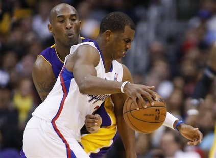 Los Angeles Clippers' Chris Paul (R) dribbles the ball as Los Angeles Lakers' Kobe Bryant (L) defends him during the second half of their NB Los Angeles Clippers' Chris Paul (R) dribbles the ball as Los Angeles Lakers' Kobe Bryant (L) defends him during the second half of their NB