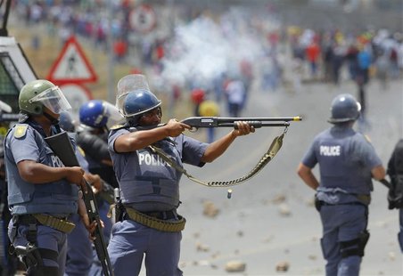 Police fire on demonstrators during a strike by farm workers at De Doorns on the N1 highway, linking Cape Town and Johannesburg, January 9, Police fire on demonstrators during a strike by farm workers at De Doorns on the N1 highway, linking Cape Town and Johannesburg, January 9,
