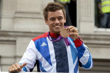 Diver Tom Daley holds his bronze medal during a parade through London September 10, 2012. REUTERS/Neil Hall Diver Tom Daley holds his bronze medal during a parade through London September 10, 2012. REUTERS/Neil Hall