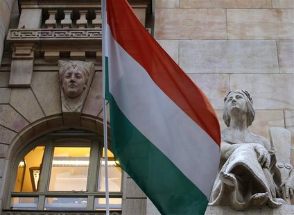 The Hungarian national flag flies on the building of the National Bank of Hungary in Budapest January 10, 2013. The bank will have a new gov The Hungarian national flag flies on the building of the National Bank of Hungary in Budapest January 10, 2013. The bank will have a new gov