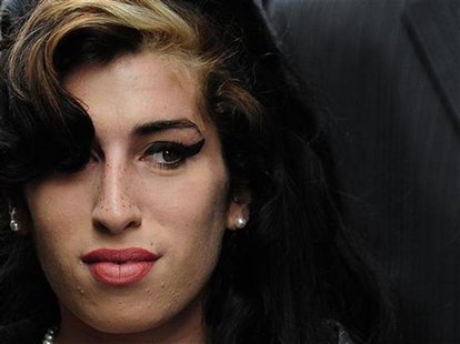 British singer Amy Winehouse arrives at Westminster Magistrates Court in central London July 23, 2009. Winehouse arrived at a London court o British singer Amy Winehouse arrives at Westminster Magistrates Court in central London July 23, 2009. Winehouse arrived at a London court o