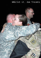 A member of the Wisconsin Army National Guard's 1157th Transportation Company is greeted upon the unit's Jan. 7, 2013 return from Afghanistan to Gulfport-Biloxi International Airport in Gulfport, Miss. A member of the Wisconsin Army National Guard's 1157th Transportation Company is greeted upon the unit's Jan. 7, 2013 return from Afghanistan to Gulfport-Biloxi International Airport in Gulfport, Miss.
