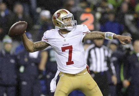 San Francisco 49ers starting quarterback Colin Kaepernick sets up to throw a pass against the Seattle Seahawks during the first quarter of t San Francisco 49ers starting quarterback Colin Kaepernick sets up to throw a pass against the Seattle Seahawks during the first quarter of t