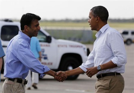 U.S. President Barack Obama shakes hands with Louisiana Governor Bobby Jindal after arriving at Louis Armstrong International Airport in New U.S. President Barack Obama shakes hands with Louisiana Governor Bobby Jindal after arriving at Louis Armstrong International Airport in New