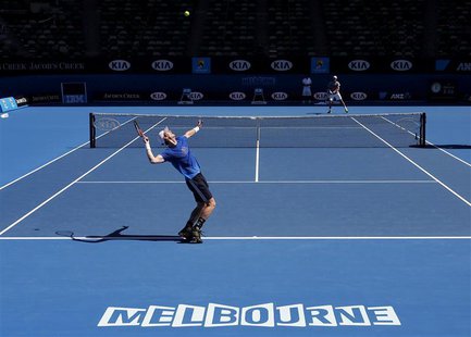 Andy Murray of Britain serves during a practice session at the Australian Open tennis tournament in Melbourne January 11, 2013. REUTERS/Tim Andy Murray of Britain serves during a practice session at the Australian Open tennis tournament in Melbourne January 11, 2013. REUTERS/Tim