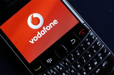 A Vodafone logo is seen on a Blackberry phone in London November 9, 2010. Vodafone. REUTERS/Suzanne Plunkett A Vodafone logo is seen on a Blackberry phone in London November 9, 2010. Vodafone. REUTERS/Suzanne Plunkett